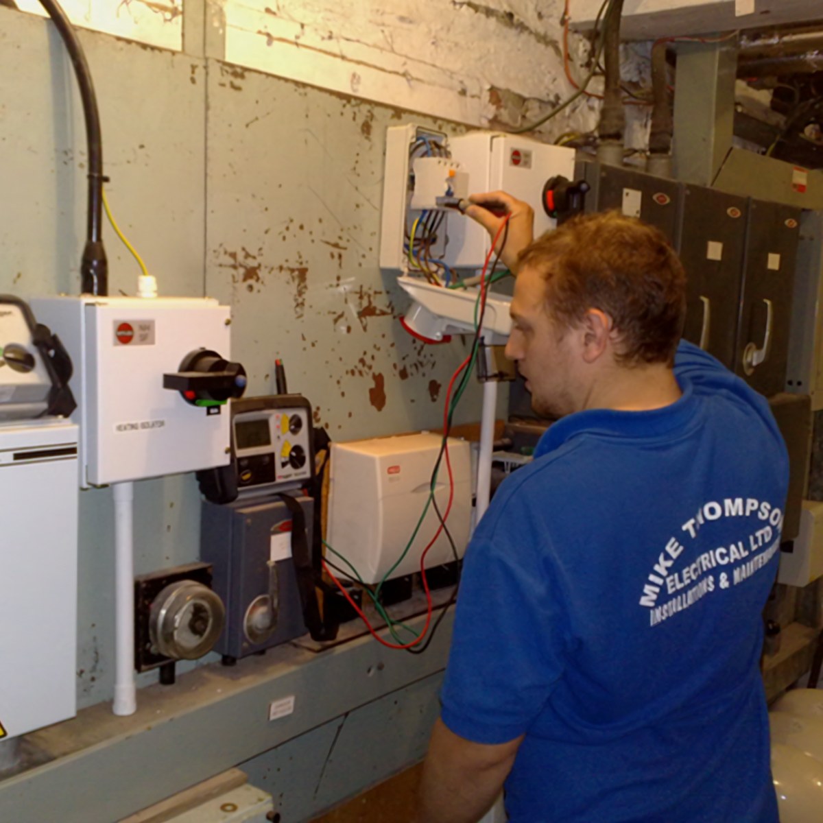A Mike Thompson Electrical engineer testing electrical equipment